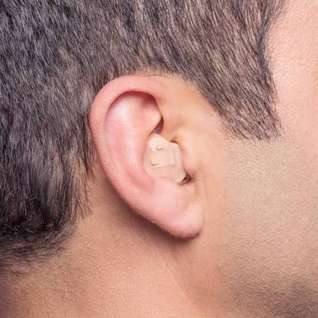 In-the-ear hearing aid worn in a man's ear