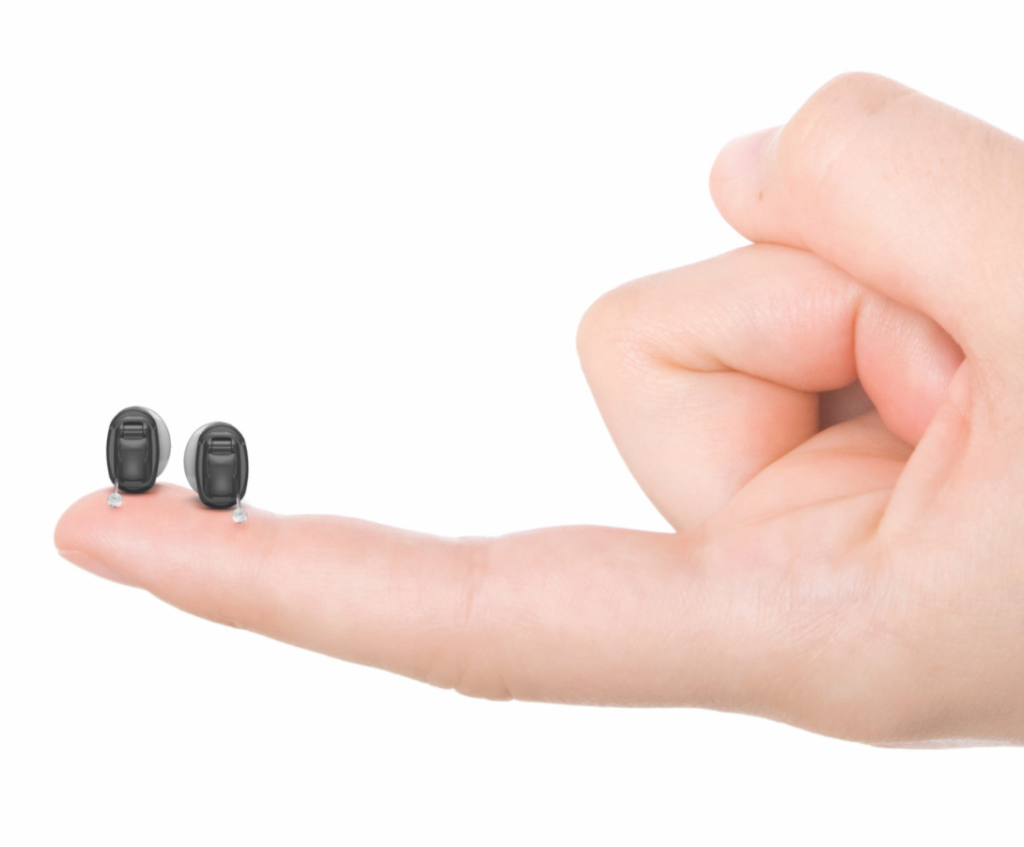 Phonak Virto Titanium invisible-in-canal hearing aids on a fingertip